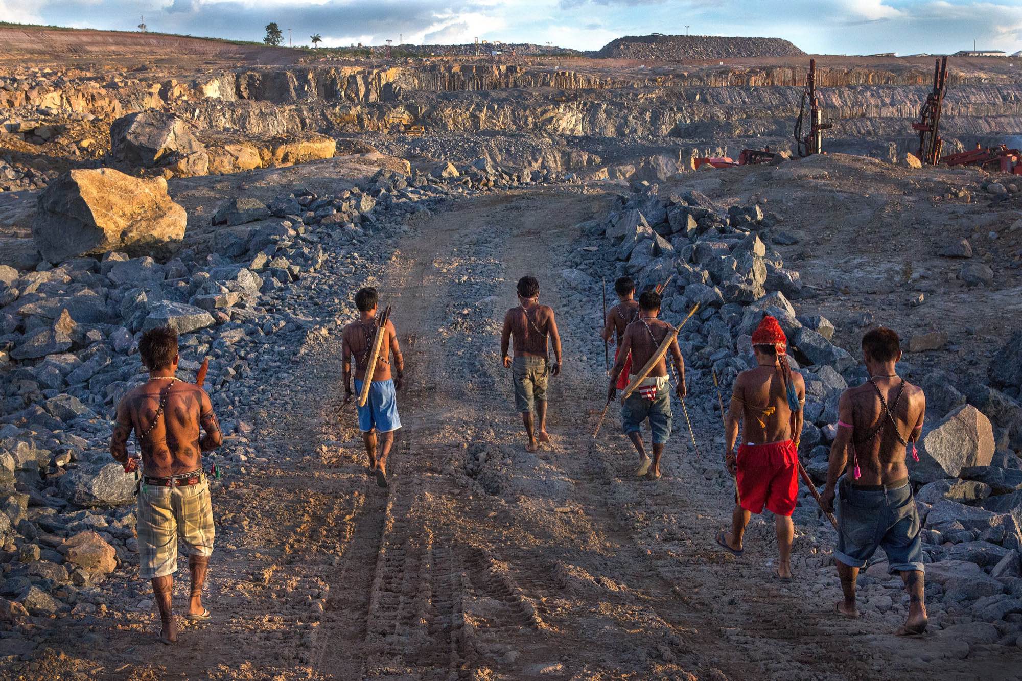 Indigenous Munduruku men survey the quarry site for the Belo Monte Dam.