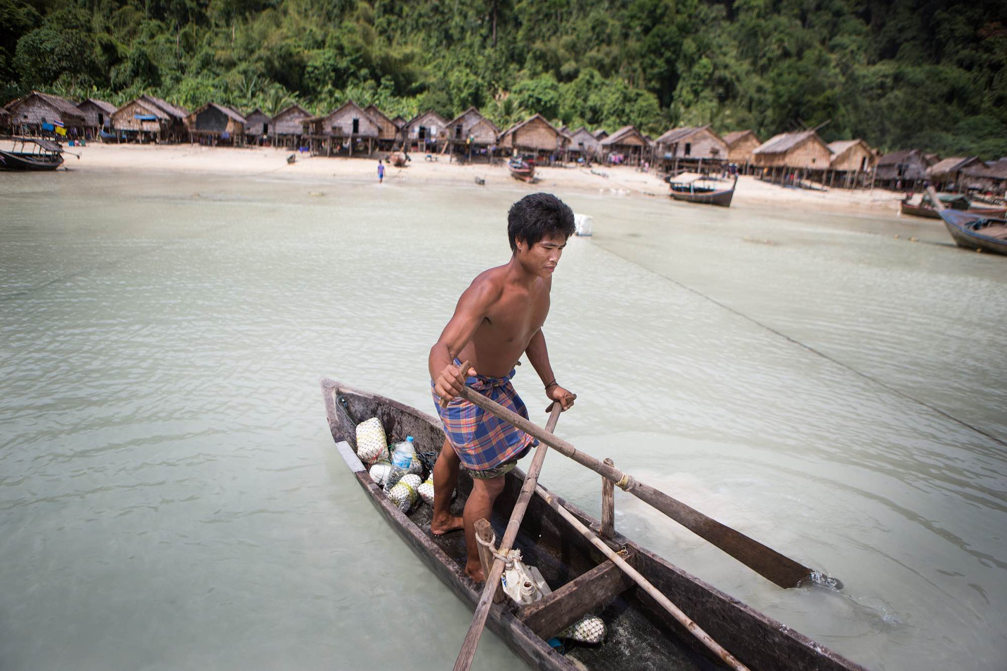 Nguy, an indigenous Moken man, rows a sampan out from his village in the Ko Surin National Park, Thailand.