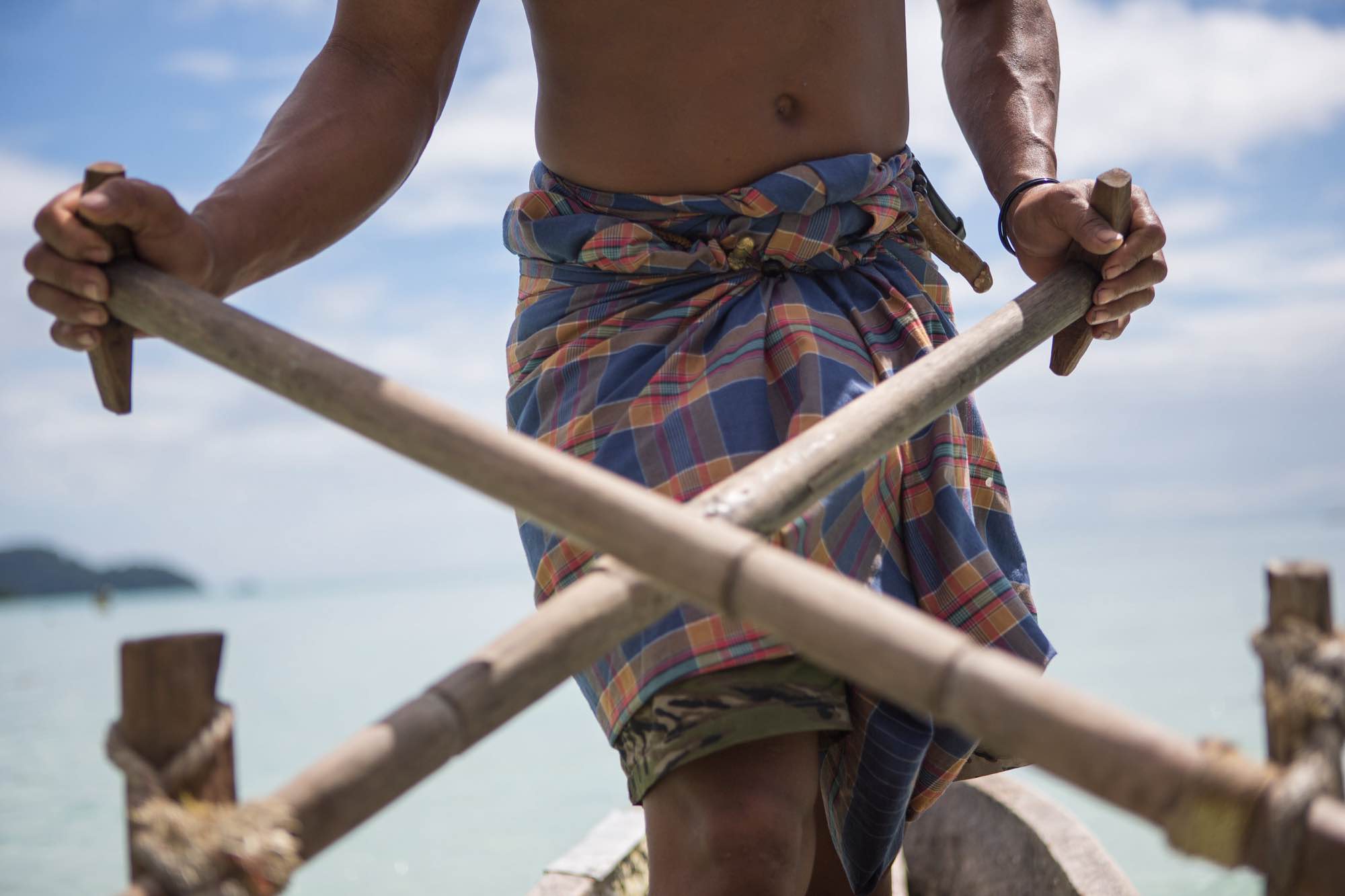 Nguy, an indigenous Moken man, rows a sampan out from his village in the Ko Surin National Park, Thailand.