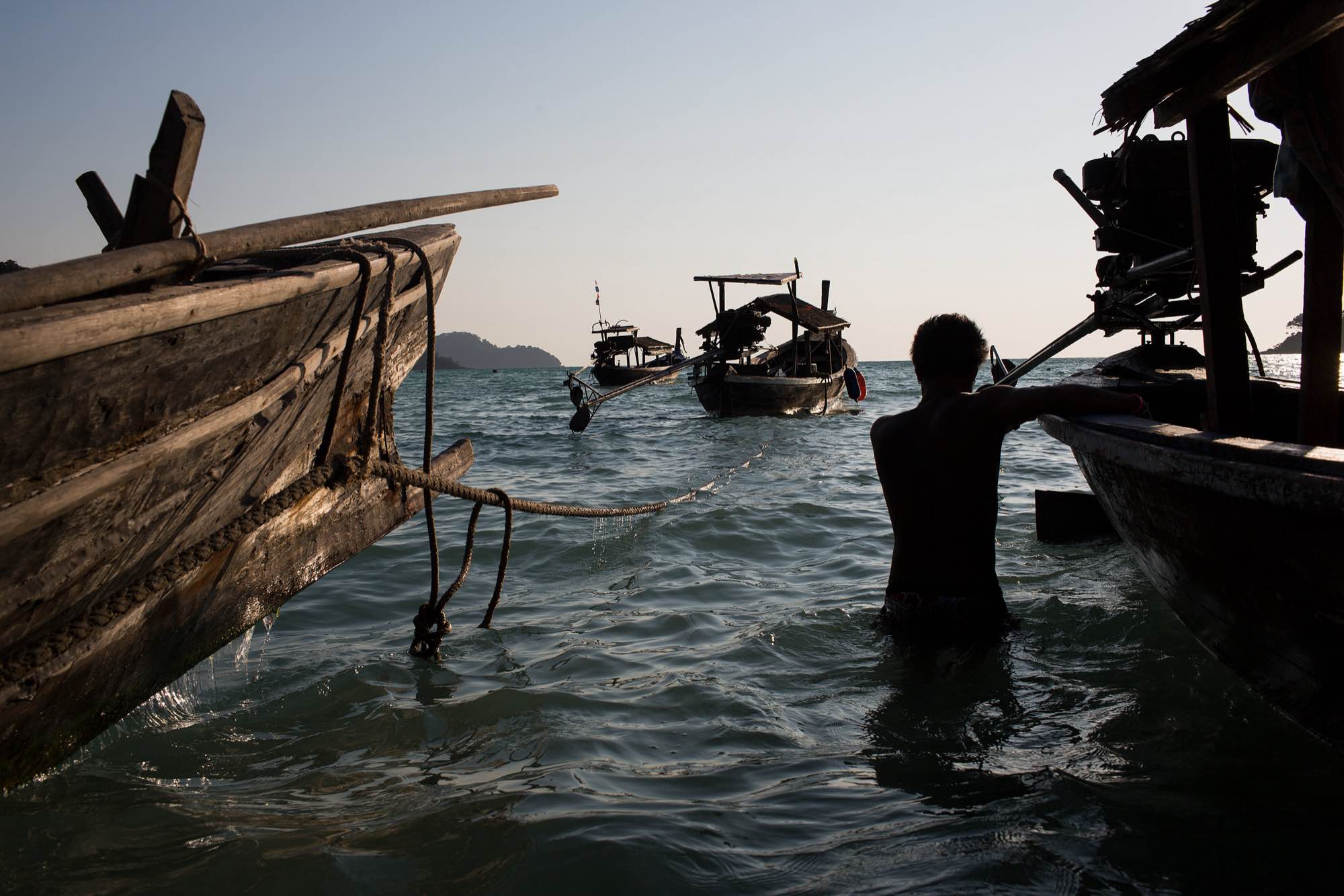 Nguy, an indigenous Moken man, takes his boat out as the tide comes in.