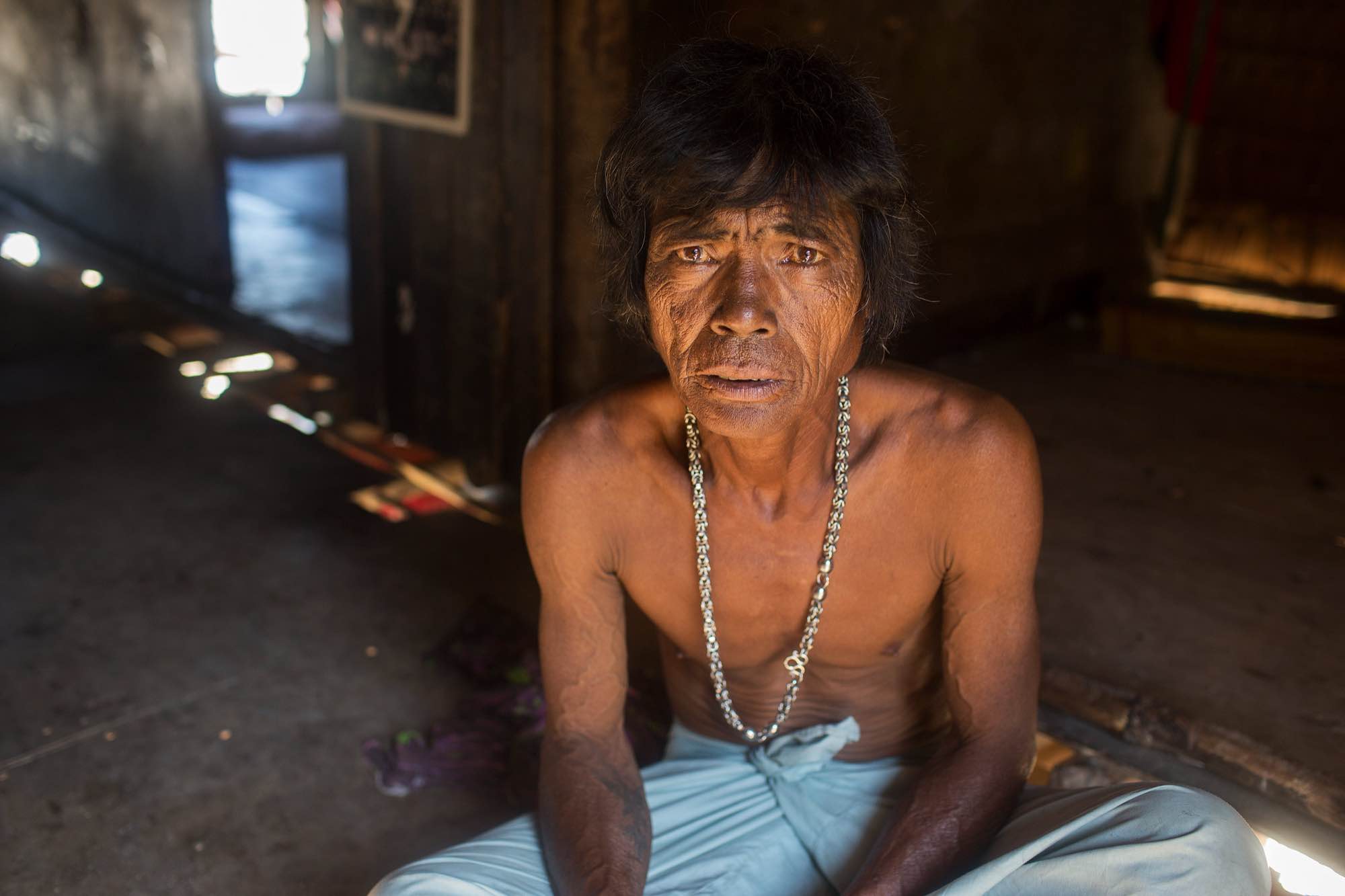 Akoo, an indigenous Moken man, in his home in Ko Surin National Park.