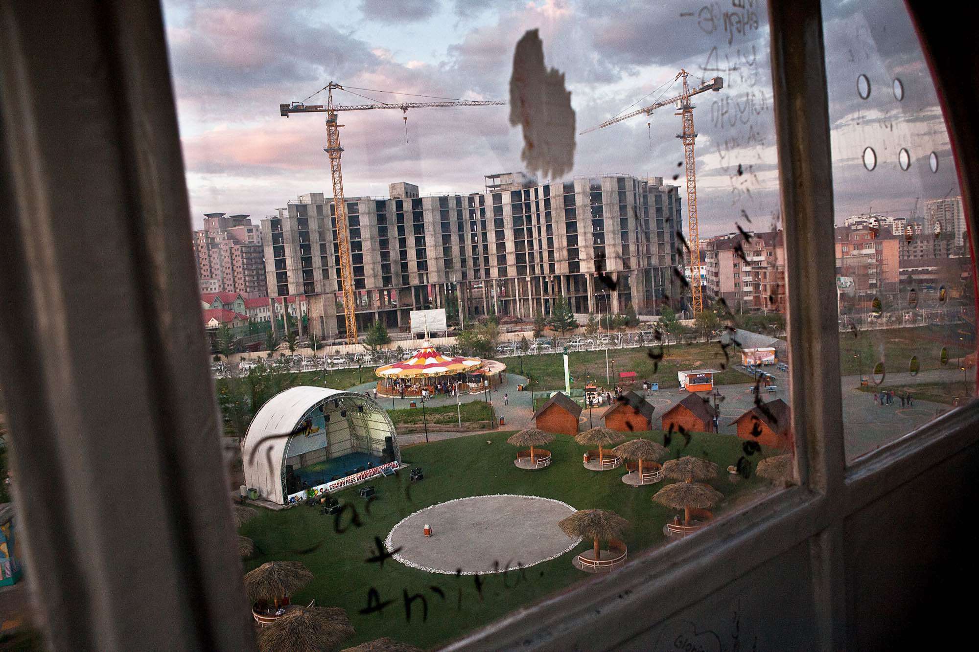 The view of a construction site in Ulaanbaatar from the ferris wheel of the city's Children's Park.