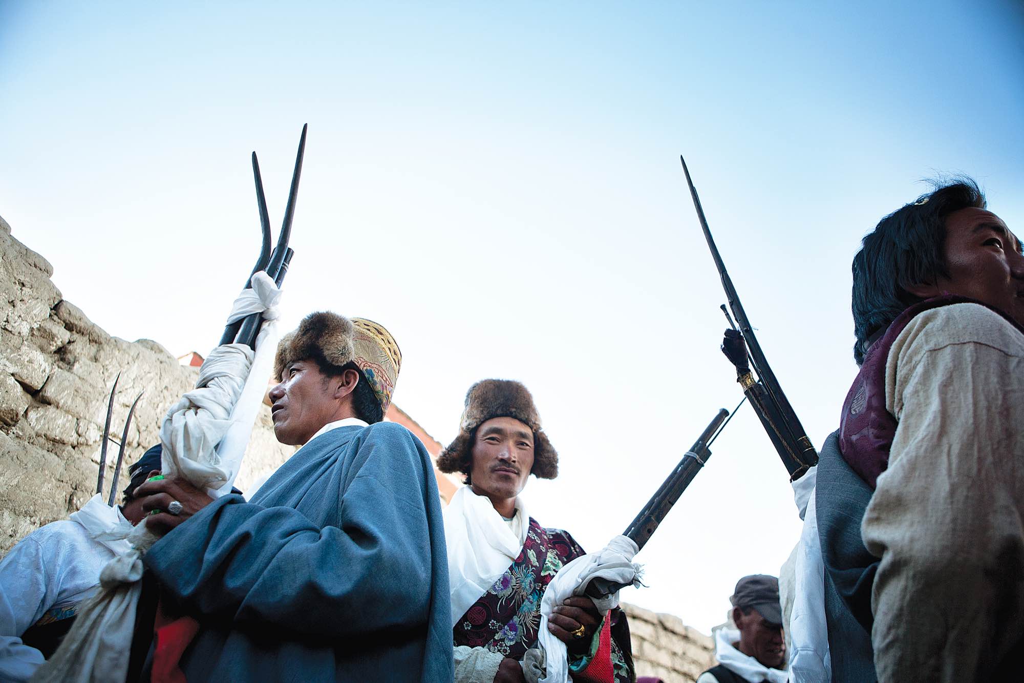 At the end of the Tiji festival, members of the king's court gather with their muskets as they prepare to help chase the demon from the city by shooting…