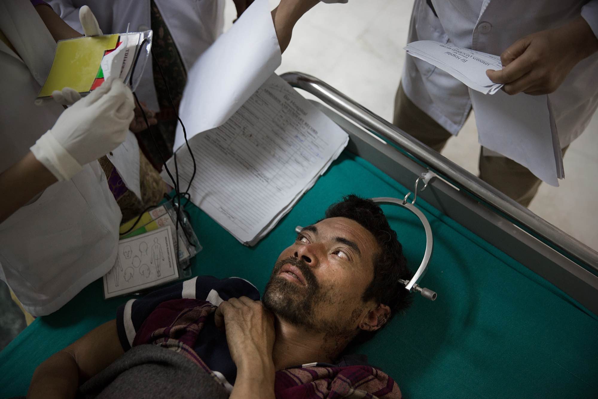 A patient has traction applied to his spinal column at a hospital in Kathmandu, Nepal on May 1, 2015.