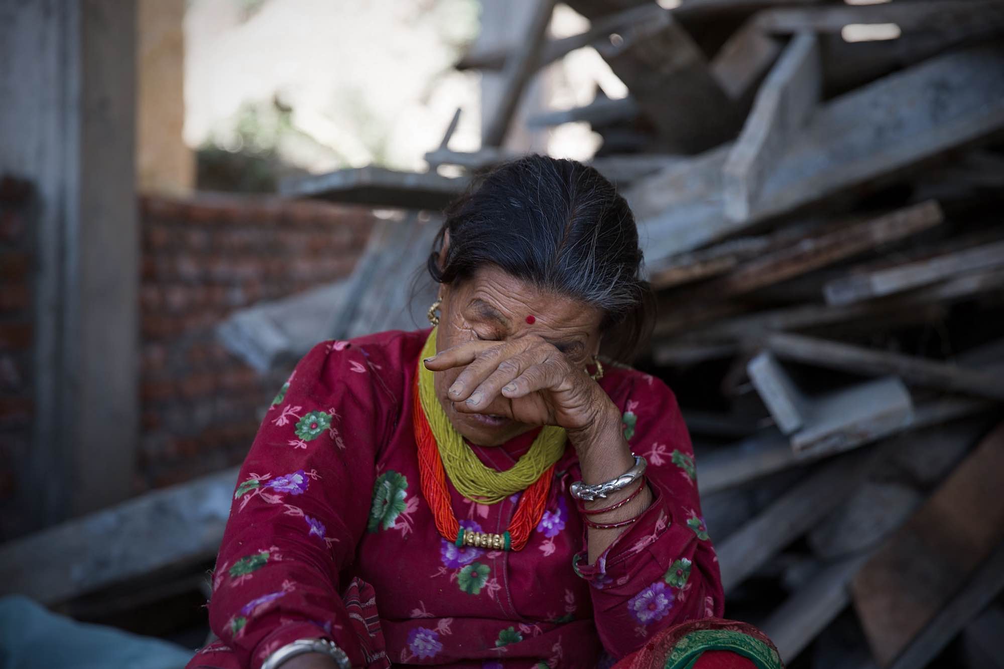 Dani Tamung, 75, cries as she describes the loss of her home and possessions due to the earthquake in Bansbari, Nepal on May 3, 2015.
